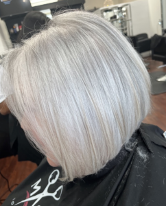 Sleek silver bob haircut with smooth texture.