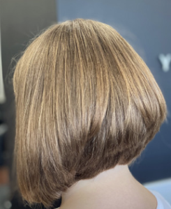 A sleek, smooth bob haircut with a subtle gradient.